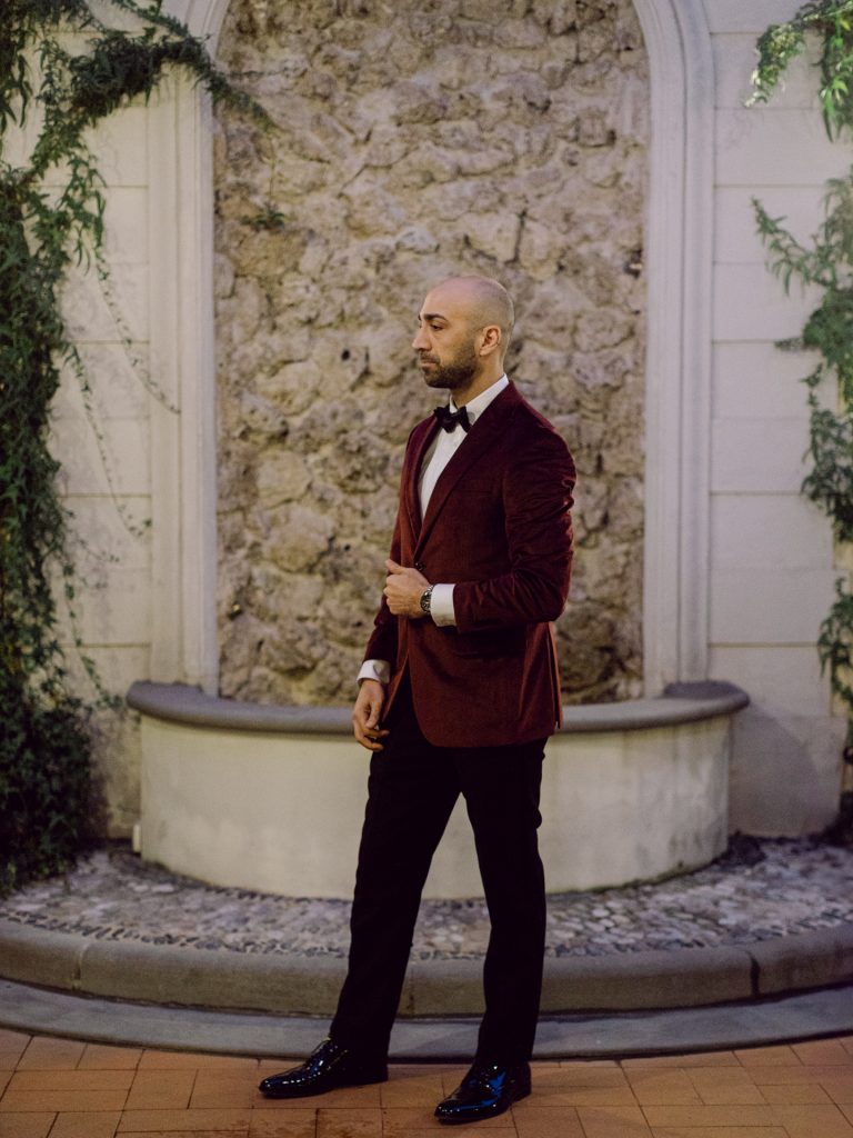 Groom getting ready at Tivoli Palazzo Gaddi decorated for Christmas in Florence