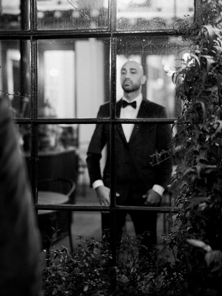 Groom getting ready at Tivoli Palazzo Gaddi decorated for Christmas in Florence