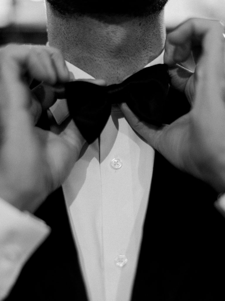 Groom getting ready at Tivoli Palazzo Gaddi decorated for Christmas in Florence