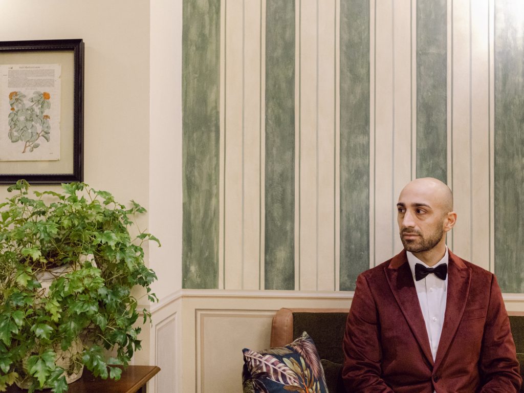 Groom getting ready at Tivoli Palazzo Gaddi decorated for Christmas in Florence