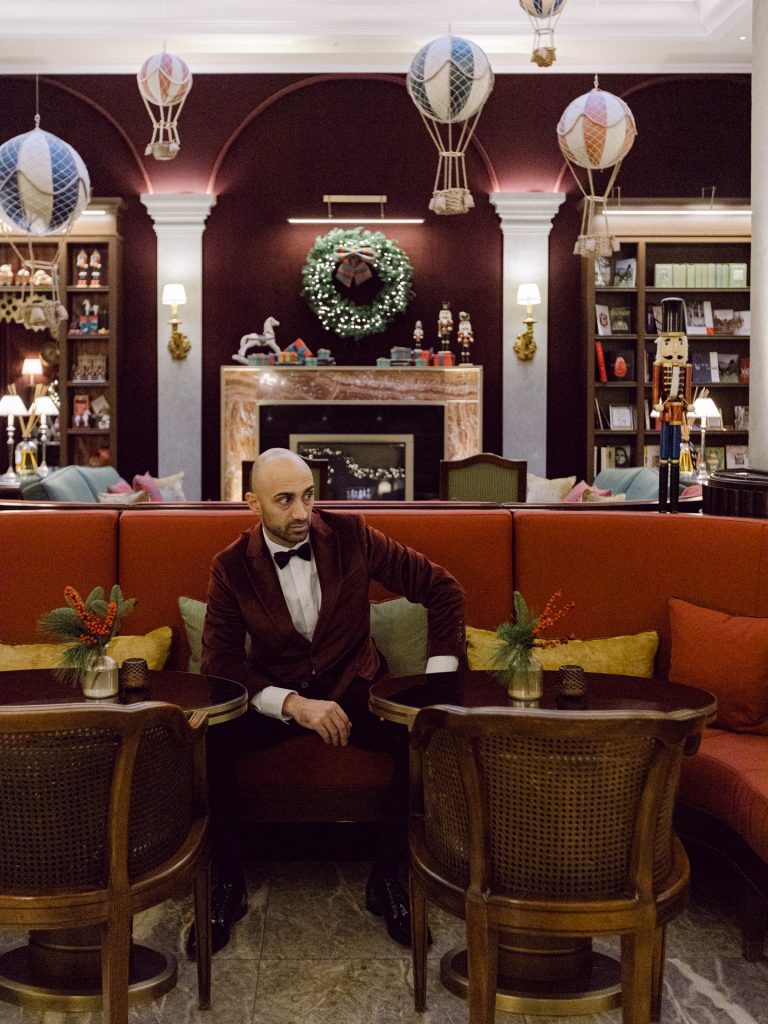Groom getting ready at Tivoli Palazzo Gaddi decorated for Christmas in Florence