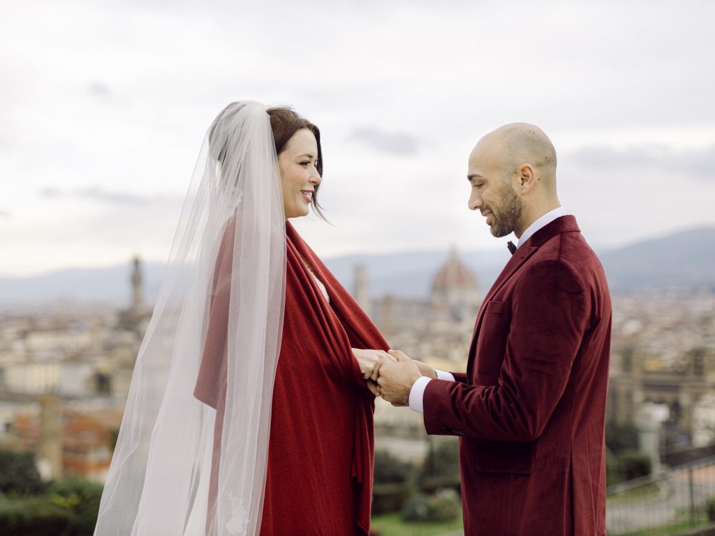 Emotional elopement ceremony overlooking Florence at Christmas
