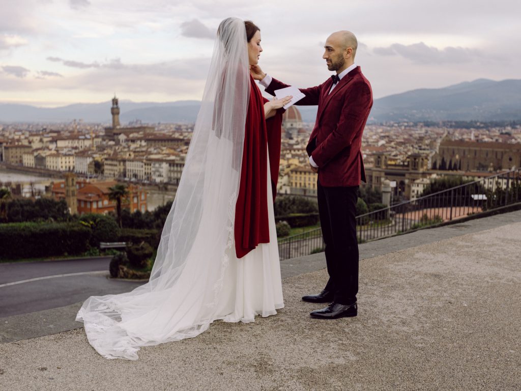 Emotional elopement ceremony overlooking Florence at Christmas