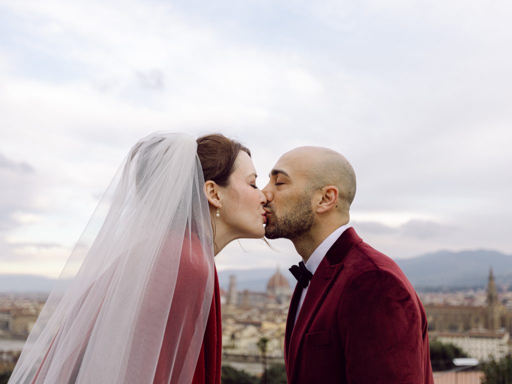 Emotional elopement ceremony overlooking Florence at Christmas