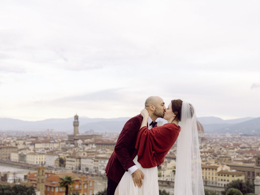 Emotional elopement ceremony overlooking Florence at Christmas