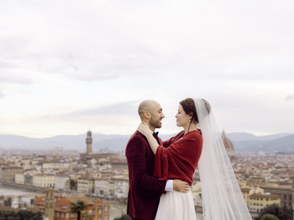 Emotional elopement ceremony overlooking Florence at Christmas
