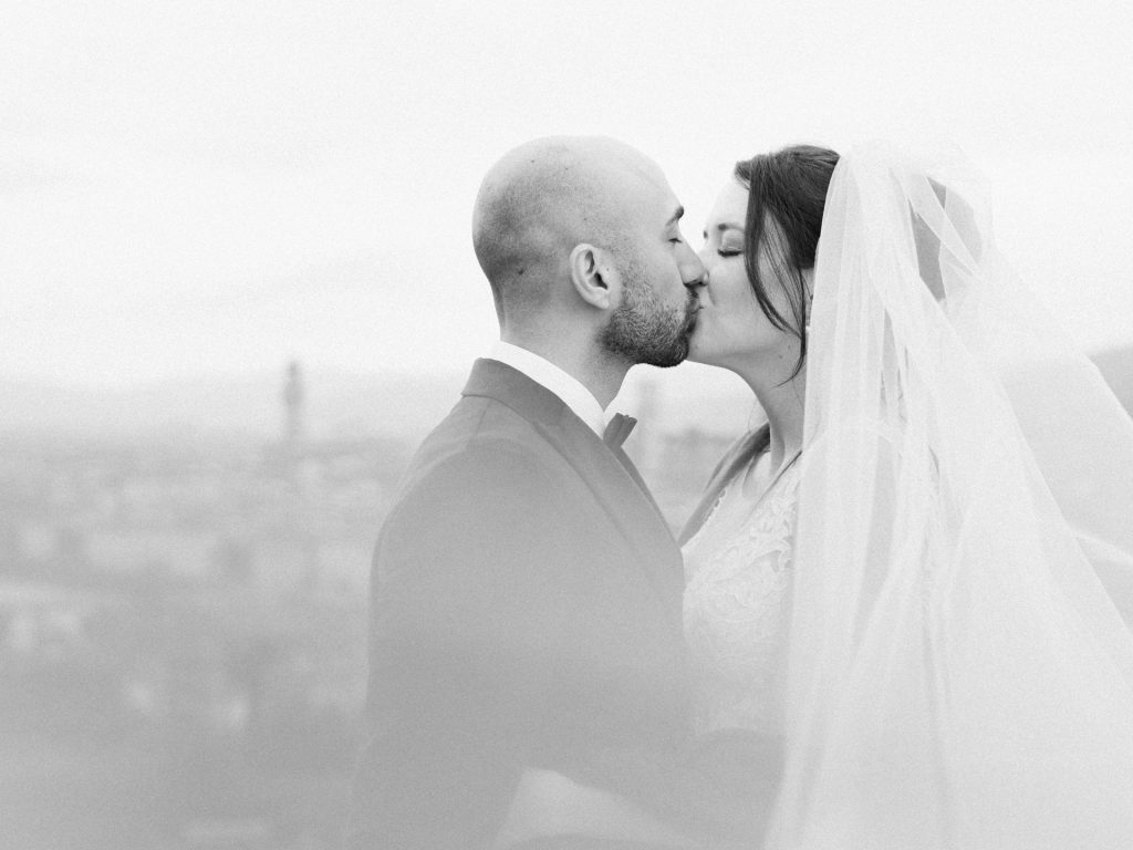Emotional elopement ceremony overlooking Florence at Christmas