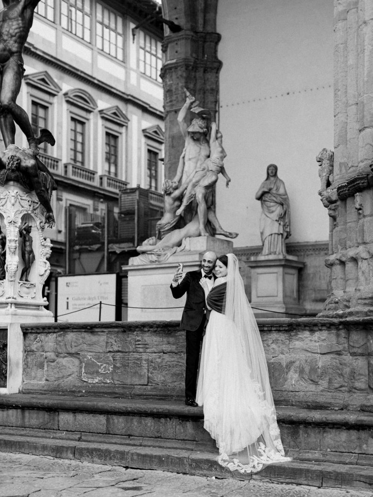 Couple walking through decorated Christmas streets in Florence city center