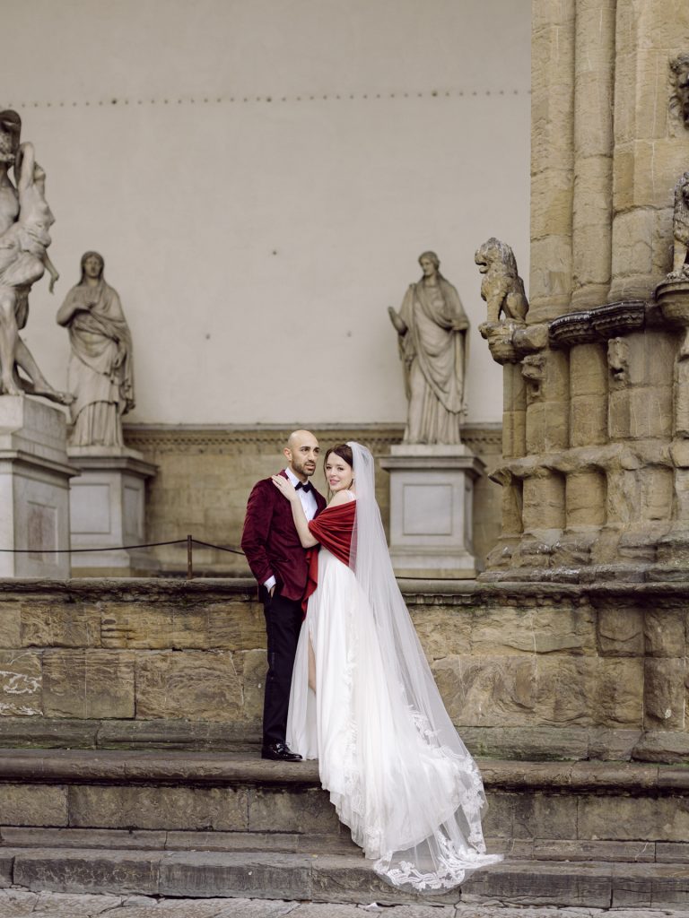 Couple walking through decorated Christmas streets in Florence city center