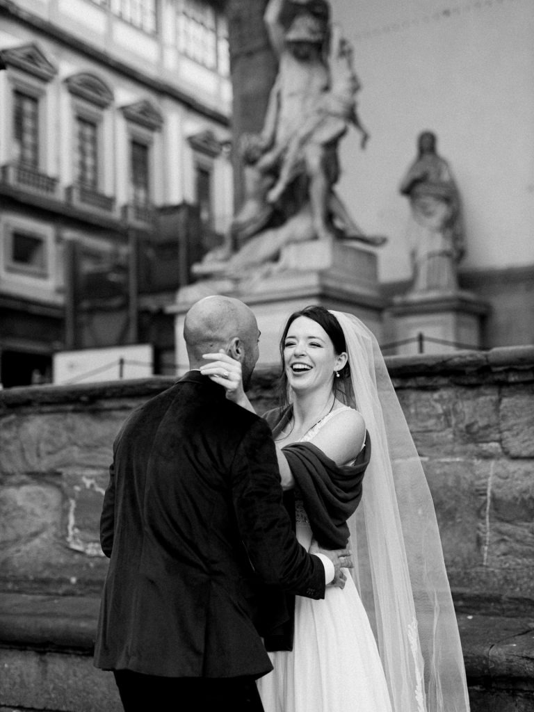 Couple walking through decorated Christmas streets in Florence city center