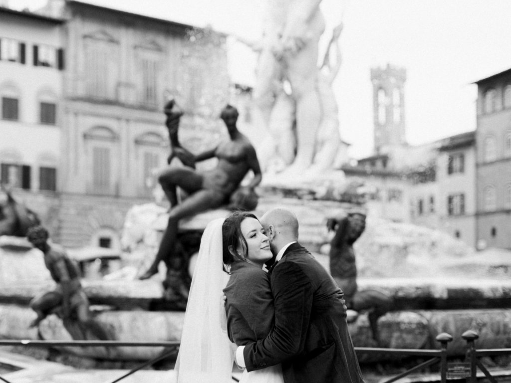 Couple walking through decorated Christmas streets in Florence city center