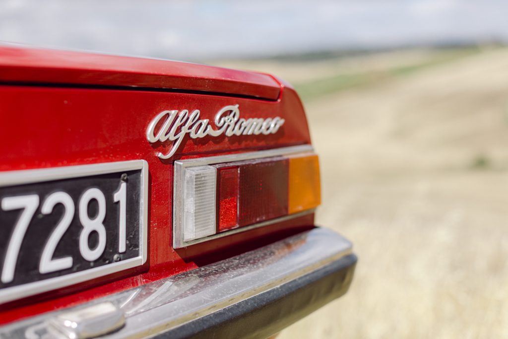 Old vintage car Alfa Romeo spider in red, detail