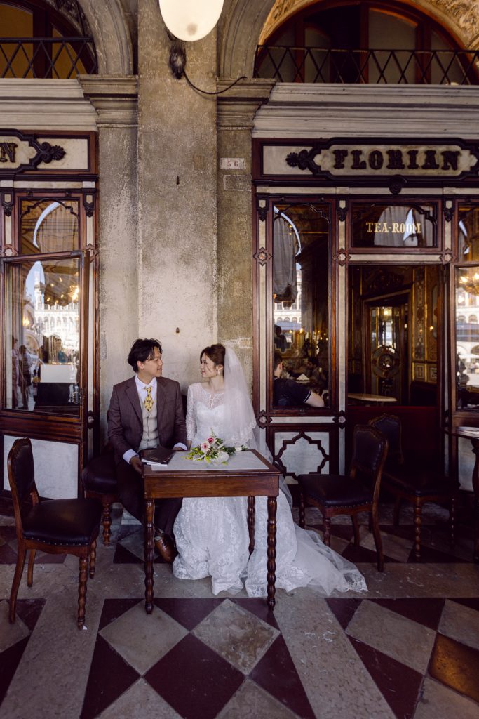 Couple having coffee at Caffè Florian in Venice