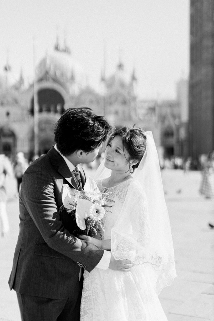 Couple in wedding attire in Piazza San Marco, Venice