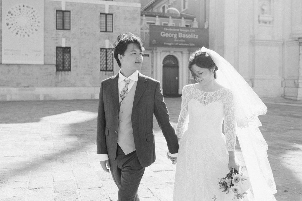 Couple in wedding attire at San Giorgio Maggiore in Venice