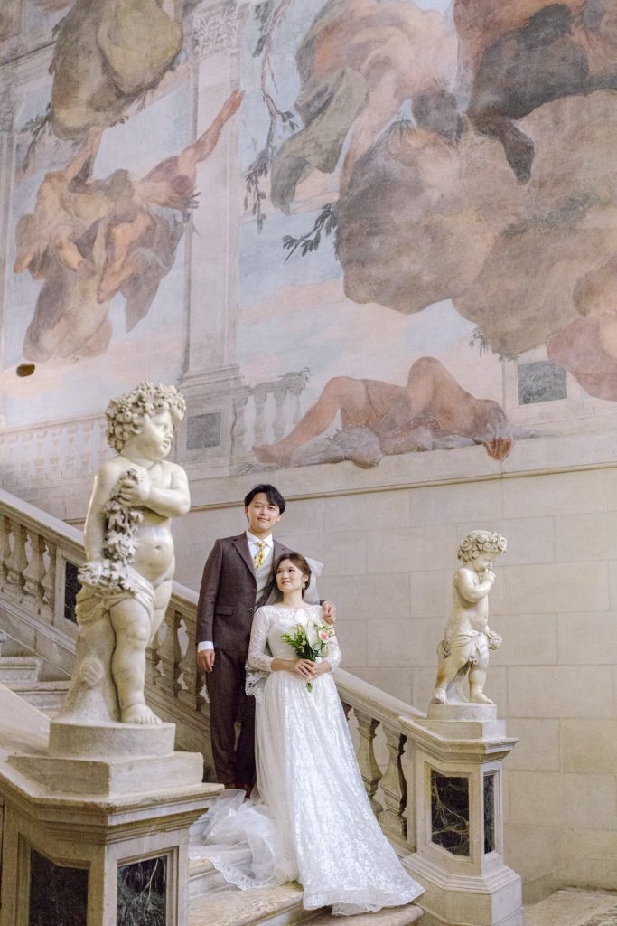Couple on Scalone dei Giganti at Ca' Sagredo in Venice monumental staircase built in the '700